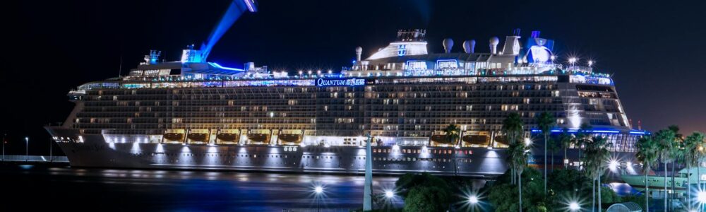 lighted ship on ocean at night